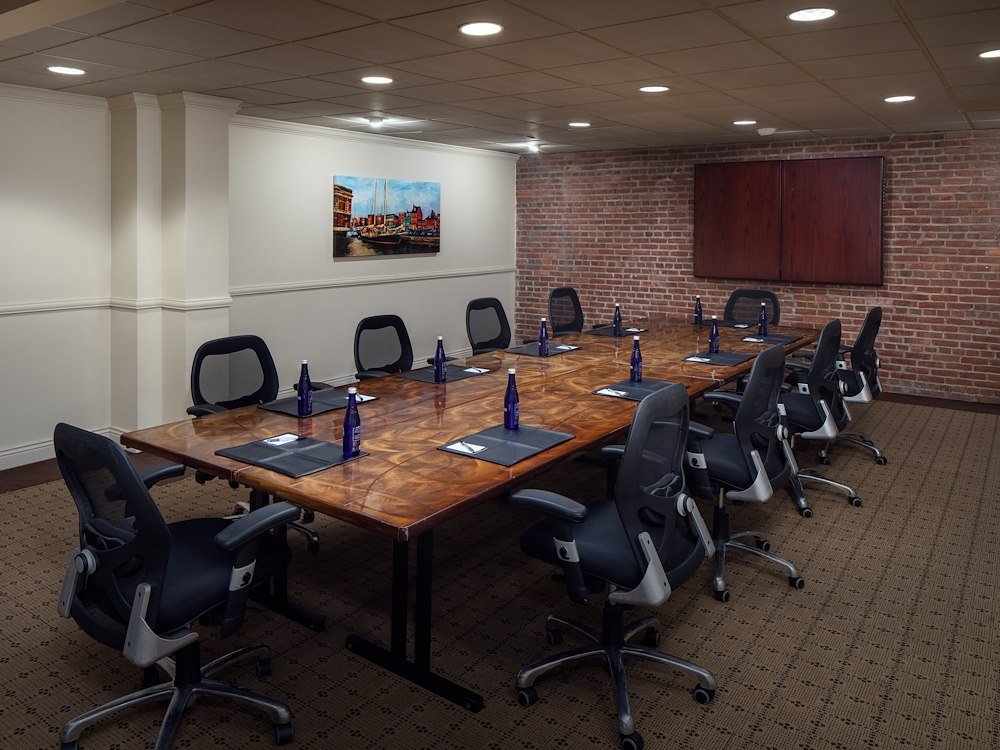 The McClintock Board Room with exposed brick and local artwork